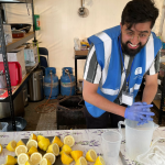 humanity first volunteer providing food to refugees